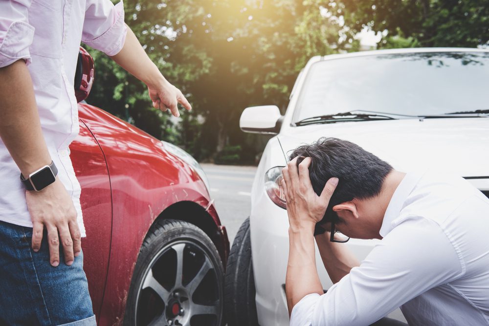 Two men arguing over car accident. 