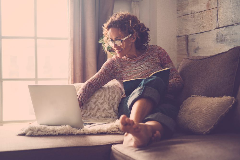 Middle aged woman shopping online.