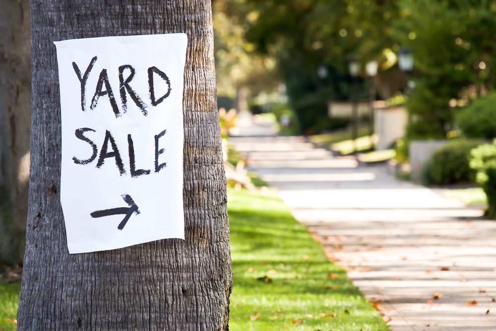 Sign towards yard sale.
