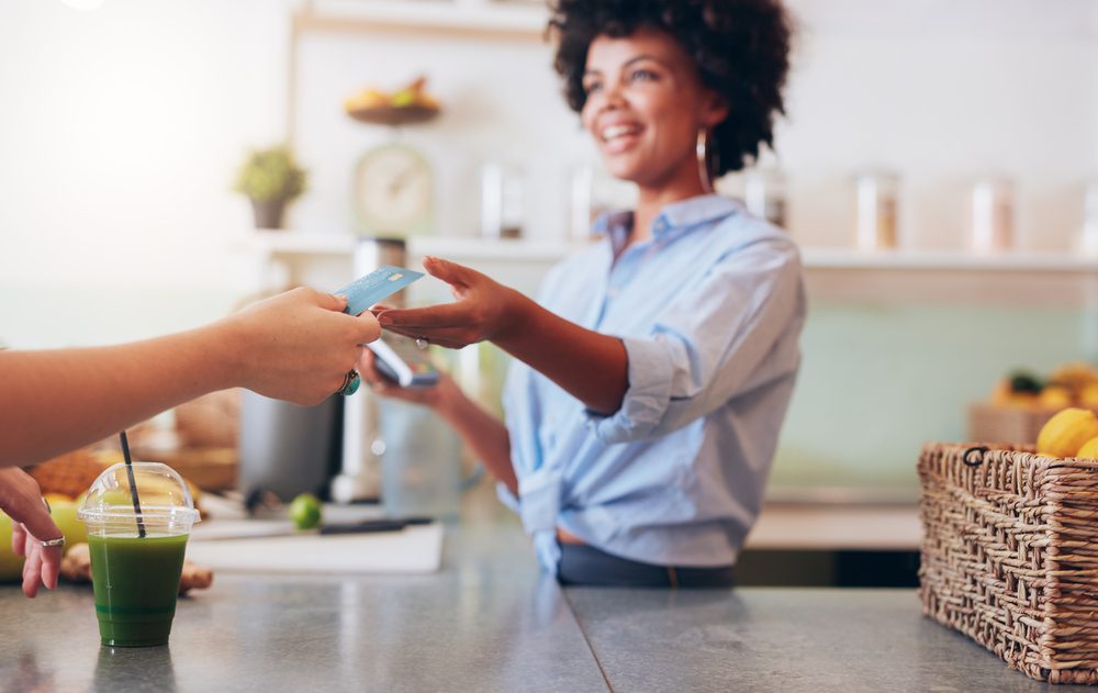 Paying at juice bar.