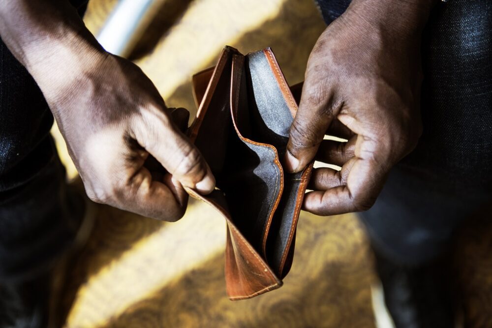 Man checking his empty wallet