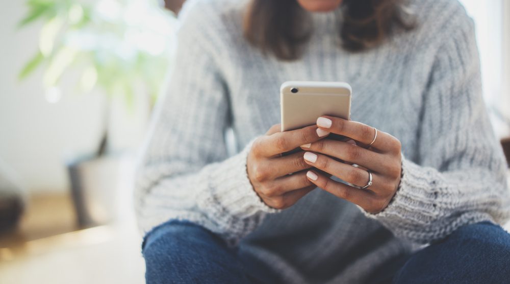 Woman using phone.